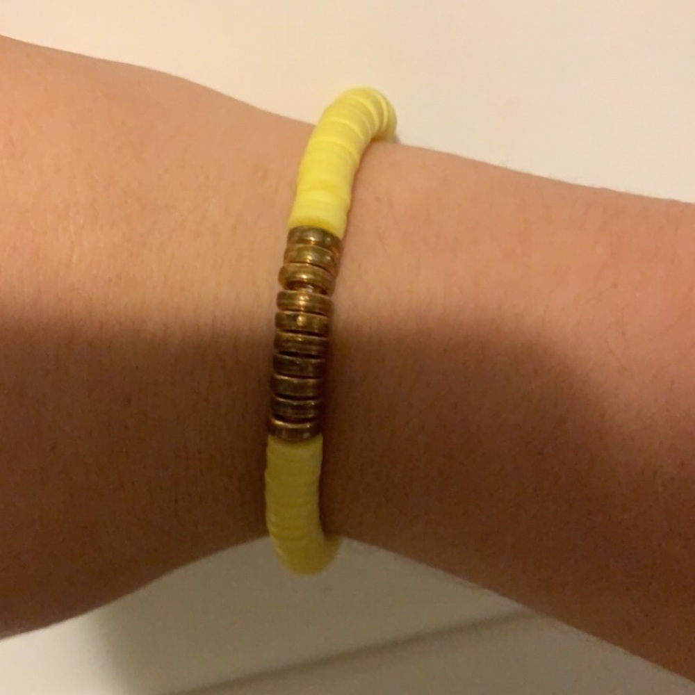 I’m selling a yellow clay bead bracelet